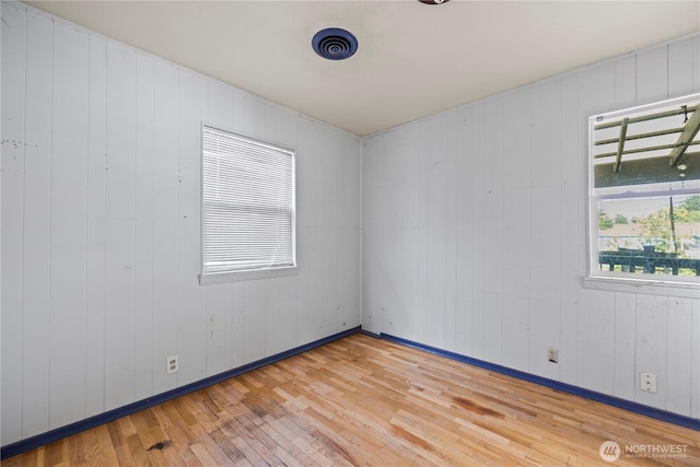 1203 S 8th Ave, Yakima, WA 98902 - spare room featuring hardwood / wood-style flooring and baseboards