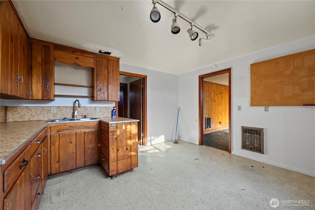 1203 S 8th Ave, Yakima, WA 98902 - kitchen featuring heating unit, brown cabinets, a fireplace, and light flooring