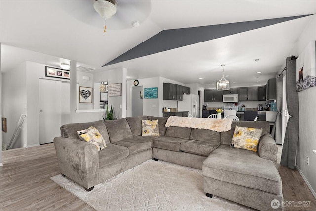 167 Goldmyer Dr, Chehalis, WA 98532 - living area featuring light wood-style flooring, lofted ceiling, a ceiling fan, and baseboards