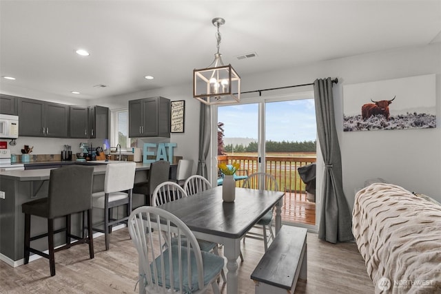 167 Goldmyer Dr, Chehalis, WA 98532 - dining room with a chandelier, recessed lighting, and light wood-style flooring