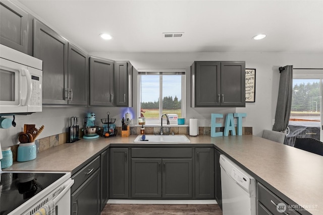 167 Goldmyer Dr, Chehalis, WA 98532 - kitchen with a sink, white appliances, recessed lighting, light countertops, and gray cabinetry