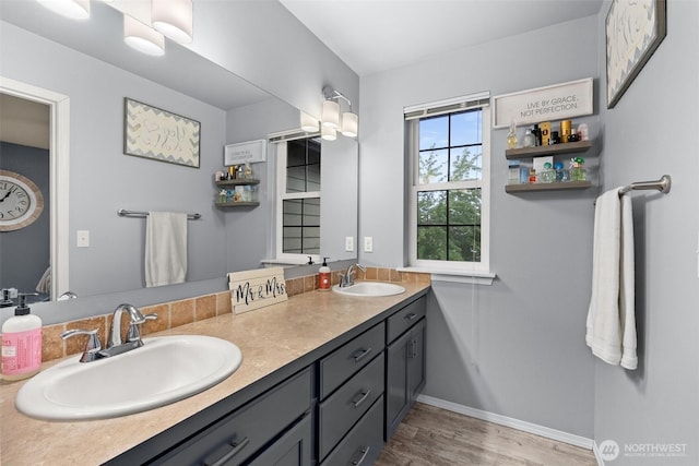 167 Goldmyer Dr, Chehalis, WA 98532 - bathroom with double vanity, baseboards, and wood finished floors