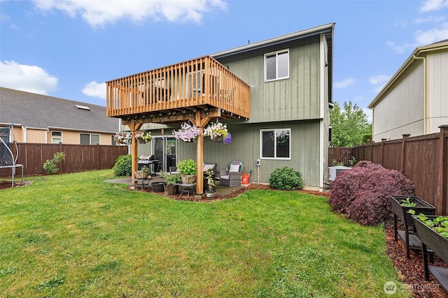 167 Goldmyer Dr, Chehalis, WA 98532 - back of property with a wooden deck, a patio, and a trampoline