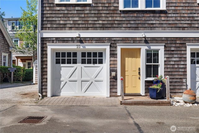 29 Laurel Ln, Pacific Beach, WA 98571 - property entrance featuring an attached garage and driveway