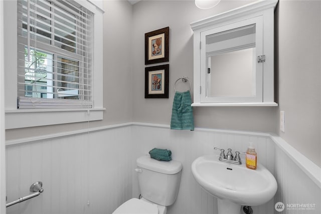 29 Laurel Ln, Pacific Beach, WA 98571 - bathroom featuring a wainscoted wall, a sink, and toilet