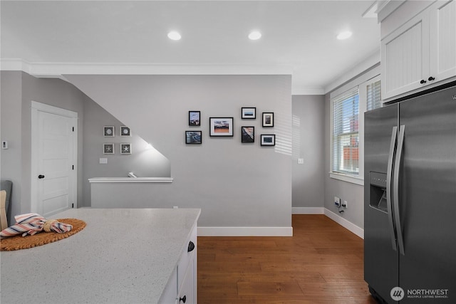 29 Laurel Ln, Pacific Beach, WA 98571 - kitchen featuring stainless steel fridge, dark wood-style floors, white cabinets, baseboards, and recessed lighting