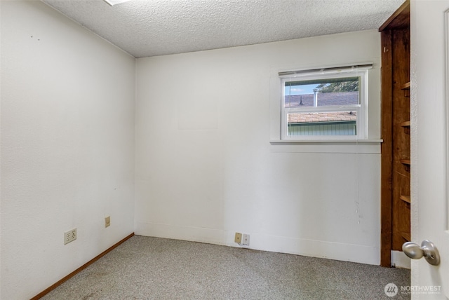 1023 W Stewart Ave, Puyallup, WA 98371 - spare room with carpet floors and a textured ceiling