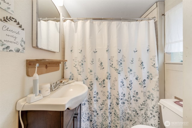 1023 W Stewart Ave, Puyallup, WA 98371 - bathroom featuring toilet, vanity, and a shower with curtain