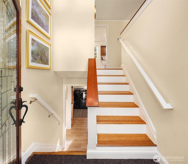 8724 Main St, Edmonds, WA 98026 - stairs with separate washer and dryer, wood finished floors, and baseboards