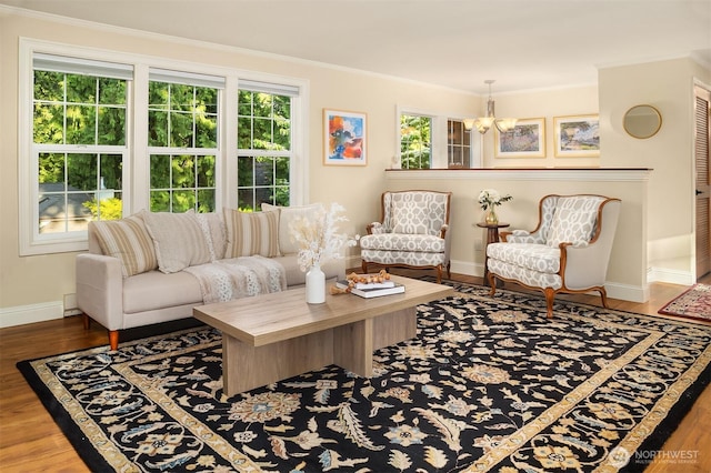 8724 Main St, Edmonds, WA 98026 - living room with baseboards, a chandelier, ornamental molding, and wood finished floors