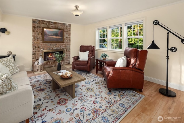 8724 Main St, Edmonds, WA 98026 - living room with wood finished floors, baseboards, and a brick fireplace