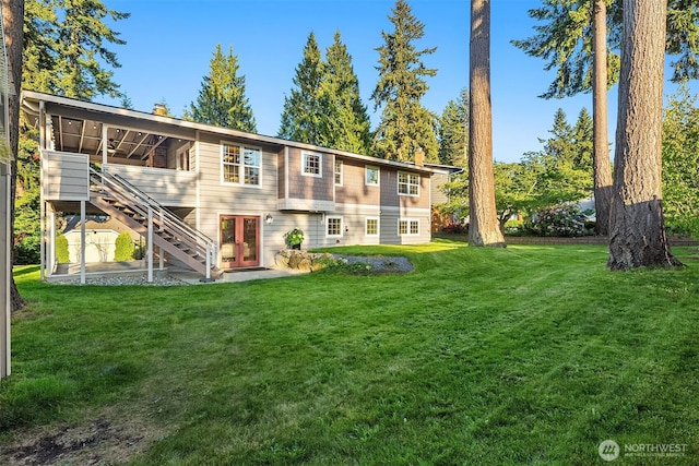 8724 Main St, Edmonds, WA 98026 - back of house featuring stairs, a lawn, and a chimney