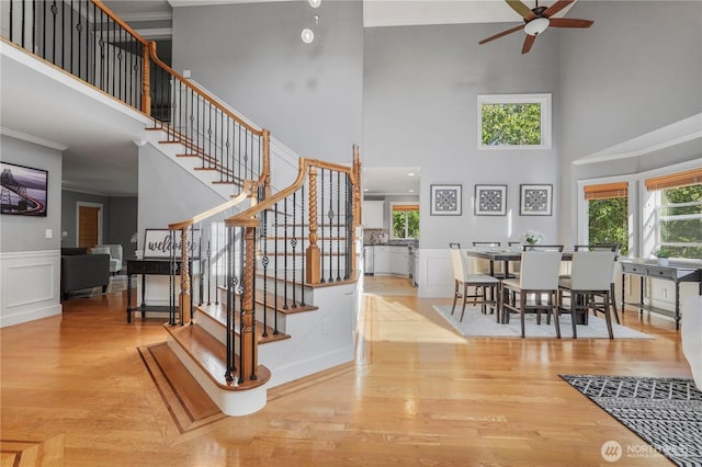 13374 SE 308th Ct, Auburn, WA 98092 - stairway with a towering ceiling, a ceiling fan, plenty of natural light, wood finished floors, and ornamental molding