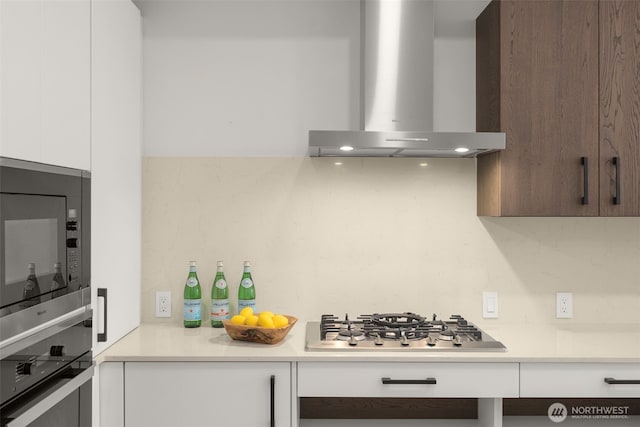 999 110th Ave NE Unit 202, Bellevue, WA 98004 - kitchen featuring wall chimney exhaust hood, black microwave, wall oven, light countertops, and white cabinets