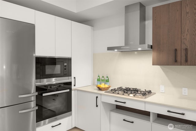 999 110th Ave NE Unit 202, Bellevue, WA 98004 - kitchen featuring appliances with stainless steel finishes, wall chimney range hood, light countertops, white cabinetry, and modern cabinets