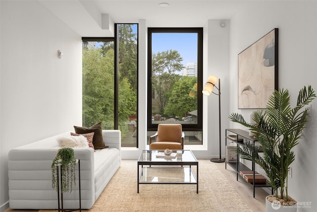999 110th Ave NE Unit 202, Bellevue, WA 98004 - living room featuring a wall of windows and wood finished floors