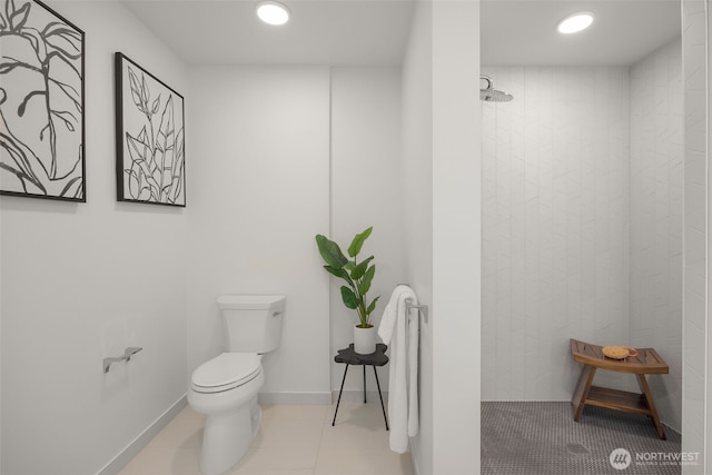 999 110th Ave NE Unit 202, Bellevue, WA 98004 - bathroom with tiled shower, toilet, recessed lighting, and tile patterned floors