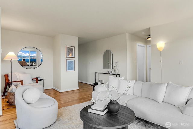 330 W Olympic Pl Unit 302, Seattle, WA 98119 - living room featuring light wood finished floors and baseboards