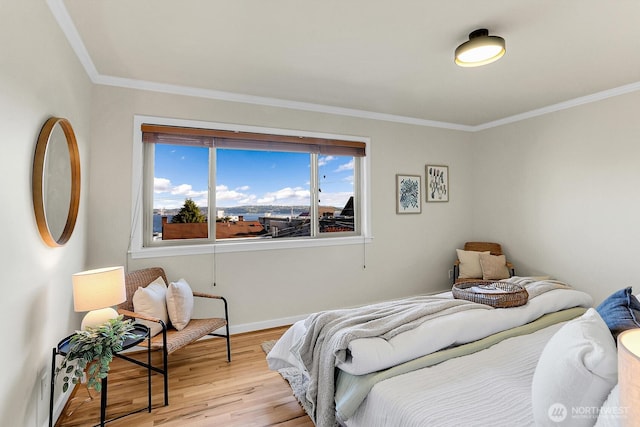 330 W Olympic Pl Unit 302, Seattle, WA 98119 - bedroom featuring light wood finished floors, baseboards, and ornamental molding