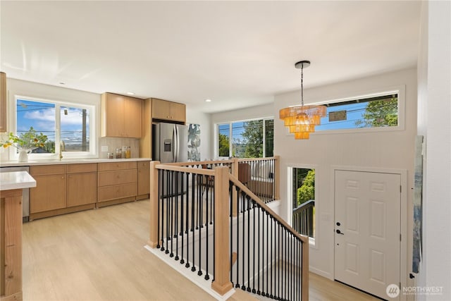 5134 S Wallace St, Seattle, WA 98178 - entrance foyer with a chandelier and light wood-style flooring