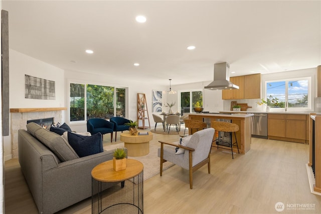 5134 S Wallace St, Seattle, WA 98178 - living area with light wood finished floors, recessed lighting, and a fireplace