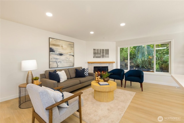 5134 S Wallace St, Seattle, WA 98178 - living area featuring baseboards, light wood-style floors, a tile fireplace, and recessed lighting