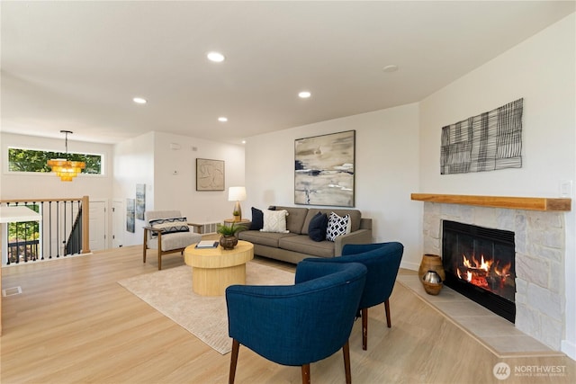 5134 S Wallace St, Seattle, WA 98178 - living area featuring light wood-style floors, a stone fireplace, and recessed lighting