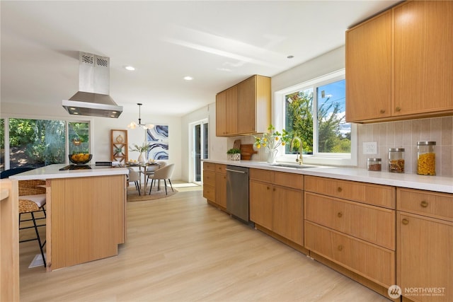 5134 S Wallace St, Seattle, WA 98178 - kitchen with island exhaust hood, stainless steel dishwasher, a sink, light wood-style floors, and light countertops