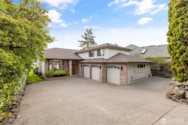 26045 Marine View Dr S, Des Moines, WA 98198 - view of front of home featuring brick siding, driveway, and roof with shingles