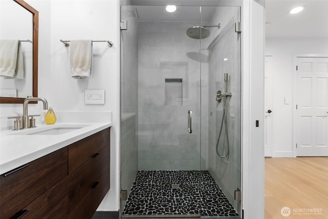 26045 Marine View Dr S, Des Moines, WA 98198 - bathroom with vanity, a shower stall, recessed lighting, and wood finished floors
