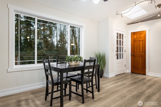 110 E Sea Breeze Dr, Grapeview, WA 98546 - dining area with wood finished floors and baseboards