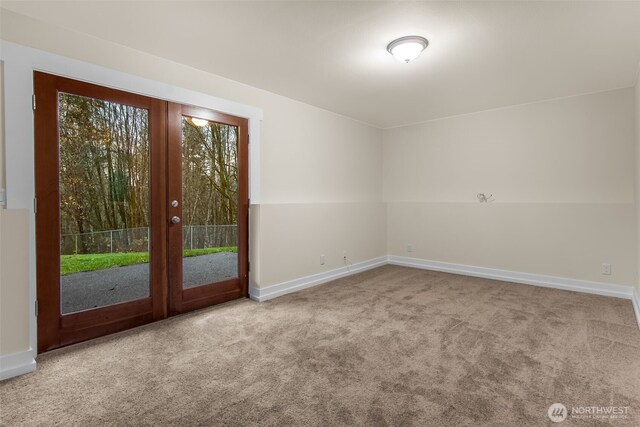 110 E Sea Breeze Dr, Grapeview, WA 98546 - carpeted spare room featuring baseboards and french doors