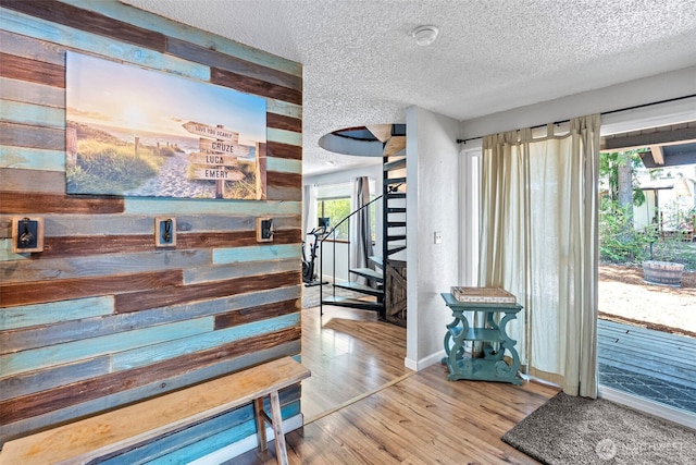 268 Kingsway W, Bremerton, WA 98312 - entryway featuring stairs, a textured ceiling, wood finished floors, and wood walls