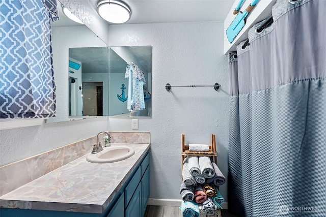 268 Kingsway W, Bremerton, WA 98312 - bathroom featuring vanity, a textured wall, and a shower with curtain