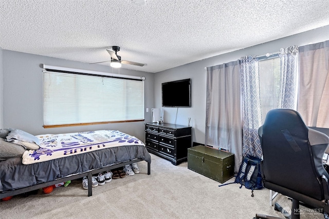 268 Kingsway W, Bremerton, WA 98312 - carpeted bedroom with multiple windows, ceiling fan, and a textured ceiling