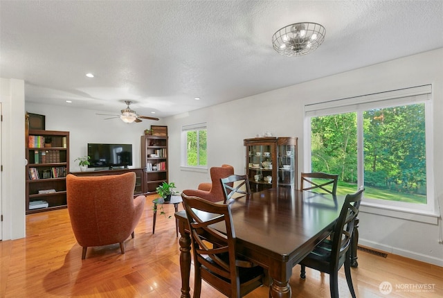 34821 NE Gable Ave, La Center, WA 98629 - dining room with light wood finished floors, ceiling fan, a textured ceiling, and recessed lighting