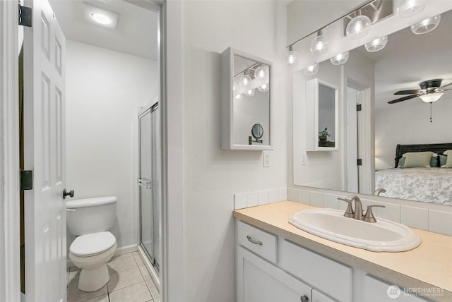 34821 NE Gable Ave, La Center, WA 98629 - ensuite bathroom with vanity, tile patterned flooring, a shower stall, and a ceiling fan