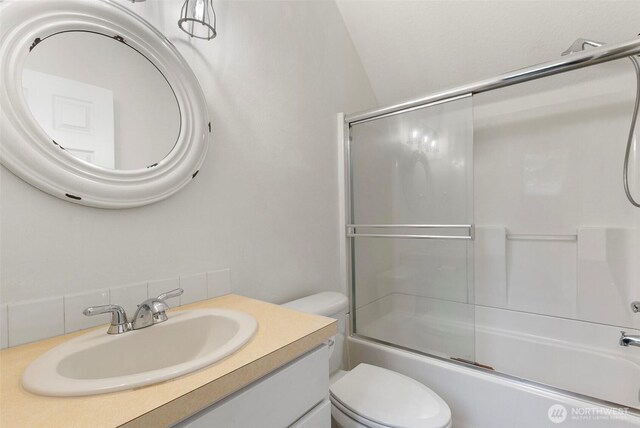 34821 NE Gable Ave, La Center, WA 98629 - full bath with vanity, combined bath / shower with glass door, and decorative backsplash