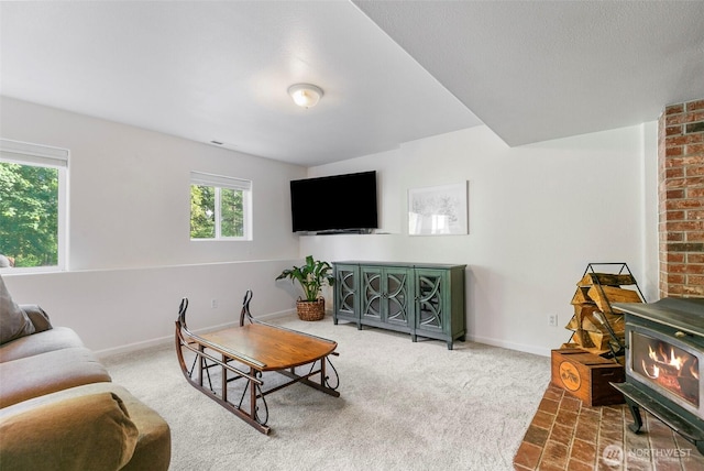 34821 NE Gable Ave, La Center, WA 98629 - carpeted living room with a wood stove and baseboards