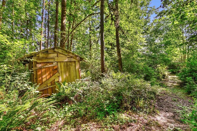 34821 NE Gable Ave, La Center, WA 98629 - view of outdoor structure featuring a wooded view