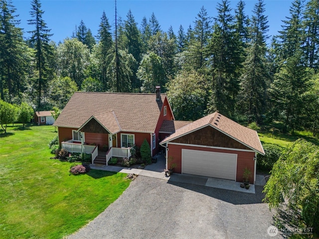 34821 NE Gable Ave, La Center, WA 98629 - view of front of home featuring a porch, a chimney, gravel driveway, a front lawn, and an attached garage