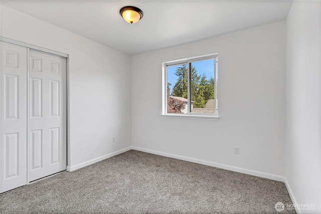 20610 6th Avenue Ct E, Spanaway, WA 98387 - unfurnished bedroom with carpet floors, a closet, and baseboards