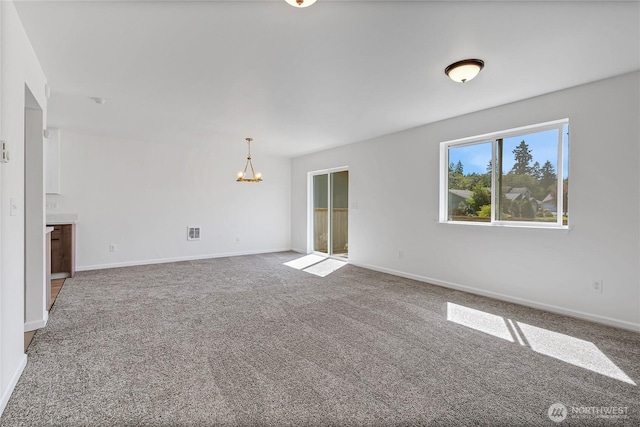 20610 6th Avenue Ct E, Spanaway, WA 98387 - empty room with a chandelier, carpet floors, and baseboards
