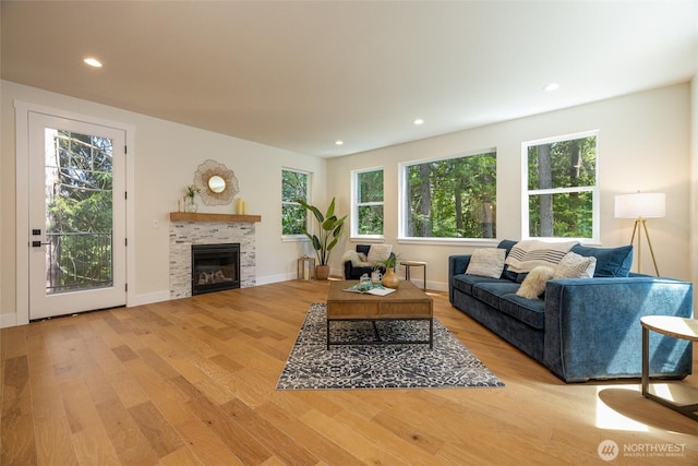 11 Kinglet Ct, Bellingham, WA 98229 - living room with wood finished floors, a glass covered fireplace, recessed lighting, and baseboards
