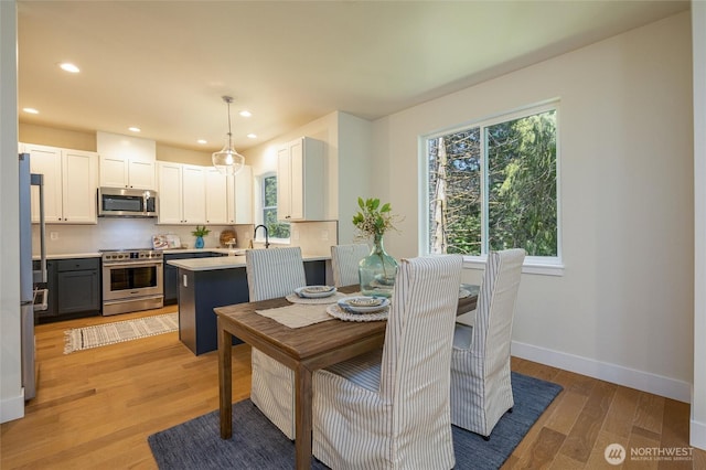 11 Kinglet Ct, Bellingham, WA 98229 - dining room featuring light wood-style floors, recessed lighting, and baseboards