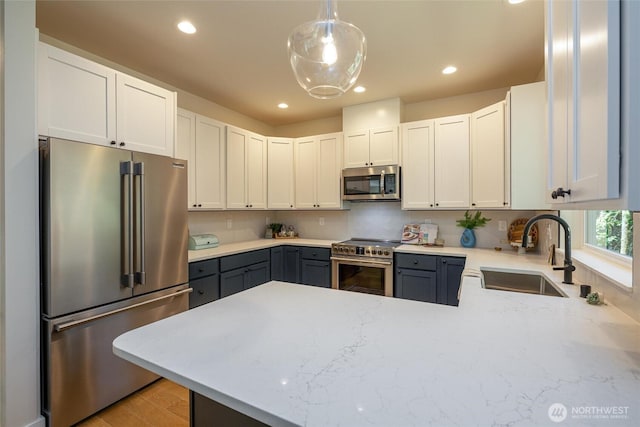 11 Kinglet Ct, Bellingham, WA 98229 - kitchen with appliances with stainless steel finishes, a sink, gray cabinets, recessed lighting, and a peninsula
