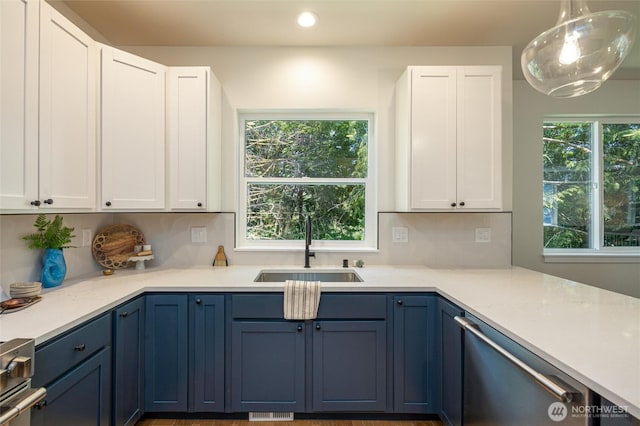 11 Kinglet Ct, Bellingham, WA 98229 - kitchen with stainless steel appliances, a sink, white cabinets, backsplash, and recessed lighting