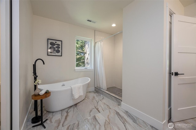 11 Kinglet Ct, Bellingham, WA 98229 - full bathroom featuring baseboards, a tile shower, a freestanding tub, marble finish flooring, and recessed lighting
