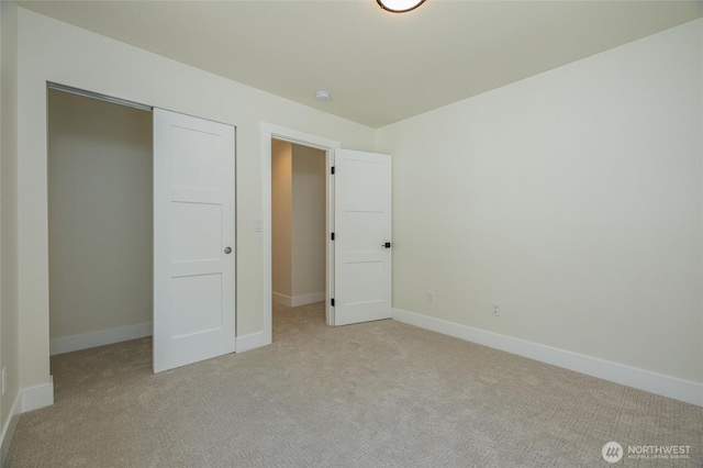 11 Kinglet Ct, Bellingham, WA 98229 - unfurnished bedroom featuring light colored carpet, baseboards, and a closet