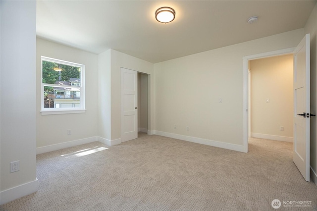11 Kinglet Ct, Bellingham, WA 98229 - unfurnished bedroom with light carpet, baseboards, and a closet